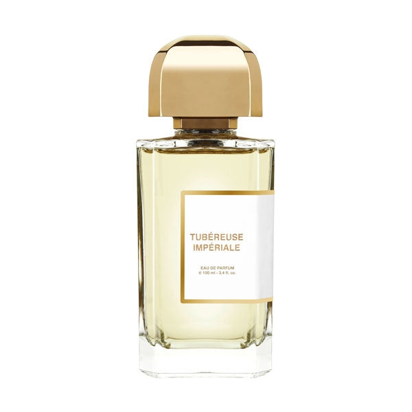 bdk Parfums - Collection Matières - Tubéreuse Impériale Parfumflakon mit goldfarbenem Verschluss und hellem Duft vor weißem Hintergrund