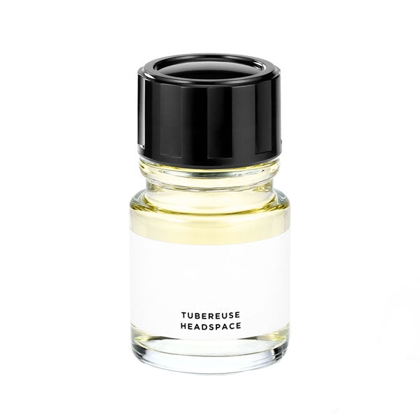 Headspace - Tubereuse Parfumflakon mit klarem Glas, schwarzem Deckel und schlichtem weißem Etikett auf weißem Hintergrund