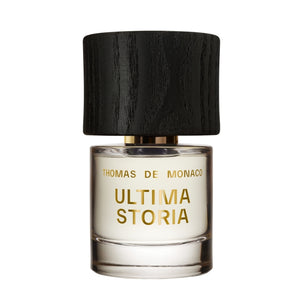 Thomas de Monaco - Ultima Storia Parfumflakon mit goldener Schrift und schwarzem Holzdeckel auf weißem Hintergrund