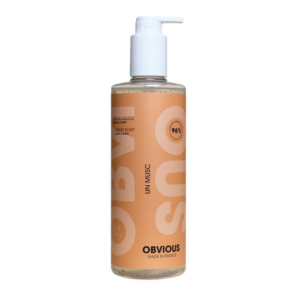 Obvious - Un Musc - Liquid Soap Hand & Body in transparenter Flasche mit Pumpspender und schlichtem orangem Etikett