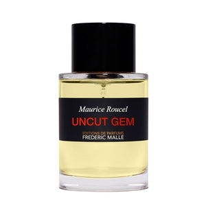 Frédéric Malle - Uncut Gem Parfumflakon mit klarem Glas, schwarzem Verschluss und schlichtem Etikett mit rotem Schriftzug vor weißem Hintergrund