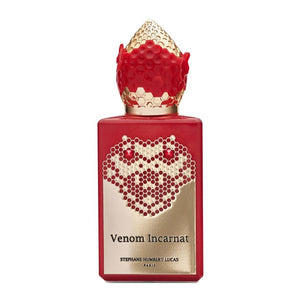 Stéphane Humbert Lucas 777 - Venom Incarnat Parfumflakon mit rotem Leder und goldener Wabenverzierung vor weißem Hintergrund
