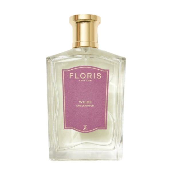 Floris - Wilde Parfumflakon mit klarem Glas und goldfarbenem Verschluss sowie violettem Etikett vor weißem Hintergrund