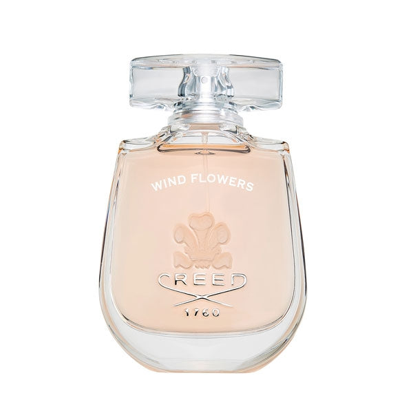Creed - Wind Flowers Parfumflakon mit zart fliederfarbenem Inhalt und klarem Glas vor weißem Hintergrund