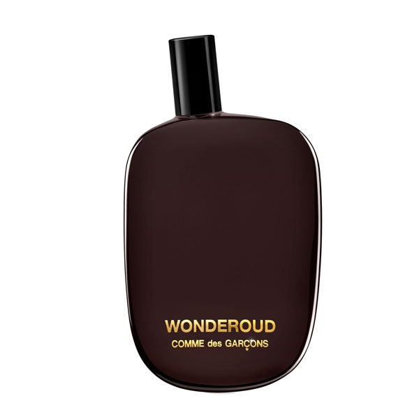Comme des Garçons - Wonderoud Parfumflakon in dunklem Braun mit schlichtem Design und goldener Schrift minimalistisch stilvoll