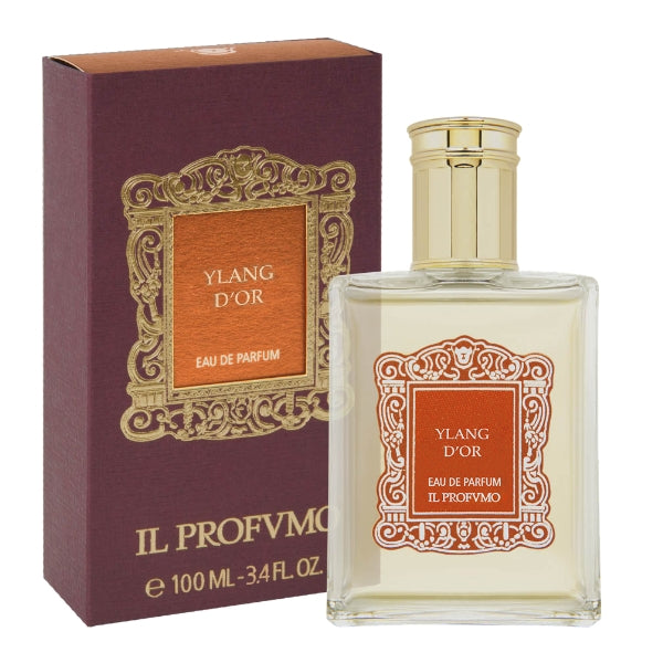 Il Profumo - Ylang d'Or eleganter Flakon mit goldfarbenem Verschluss und verziertem Etikett neben tiefroter Verpackung